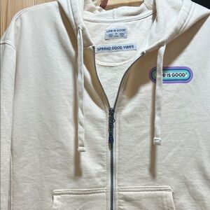 Life Is Good ladies cream colored zip up hoodie size medium